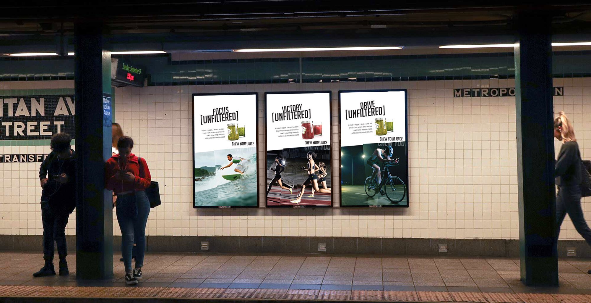 Underground subway station with three digital ads promoting unfiltered juice, featuring images of athletes water skiing, running, and cycling.